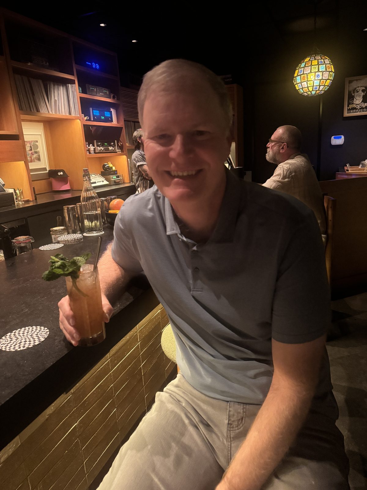 Todd with a cocktail at a hi-fi listening bar